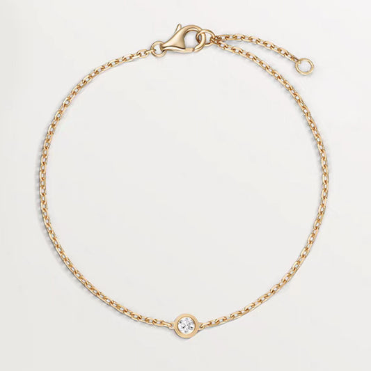 Pulso con charm con diamante (0.13 ct- 0.143 ct)
